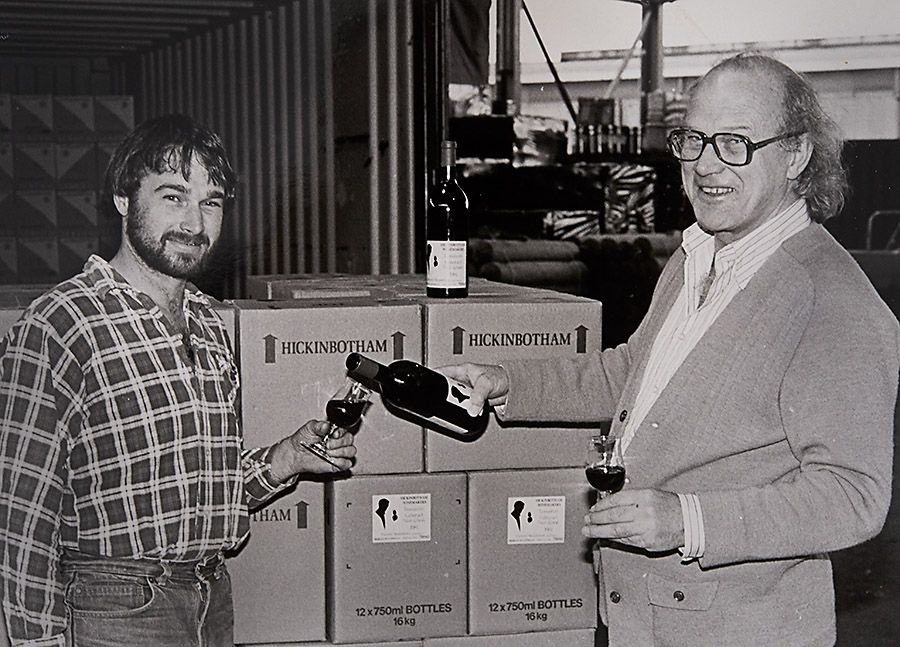 Ian pours his son Stephen a glass of Meadowabnk 1981 Cabernet Sauvignon, to celebrate the first shippment to New Zealand : Image supplied 