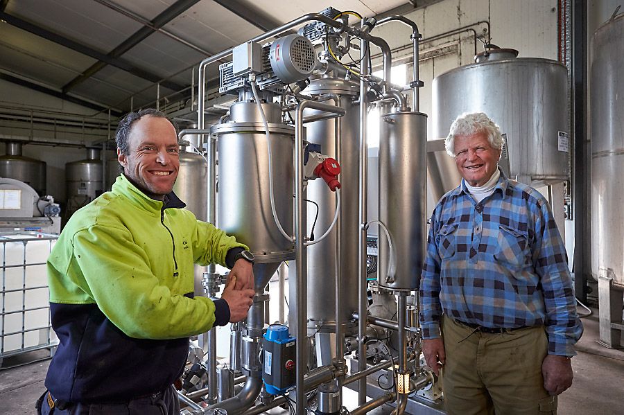 Bill with Chambers Rosewood winemaker his son Stephen and the new filter machine. Photo : Milton Wordley