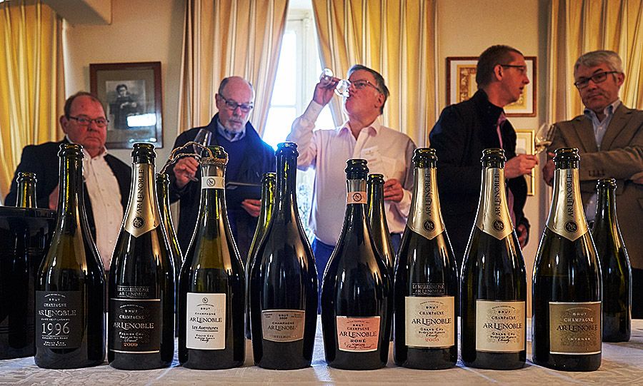 Tasting at the Champagne house of 'AR Lenoble'. Tim Johnston front and centre, with a few of the other tasters and the line up. Photo © Milton Wordley.