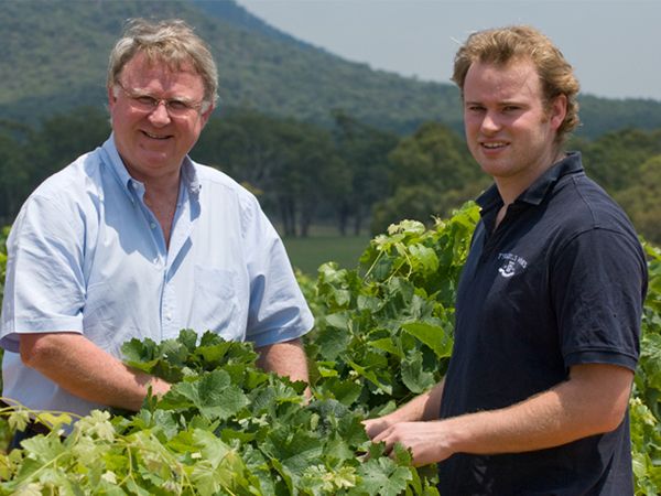 Bruce and his son Chris in the vineyard.