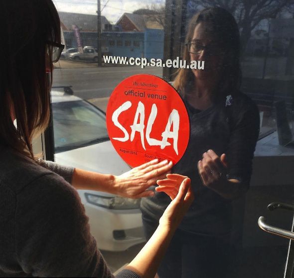 The SALA sign goes up at the CCP.  Photo : Alyssa ©  Cavanagh.
