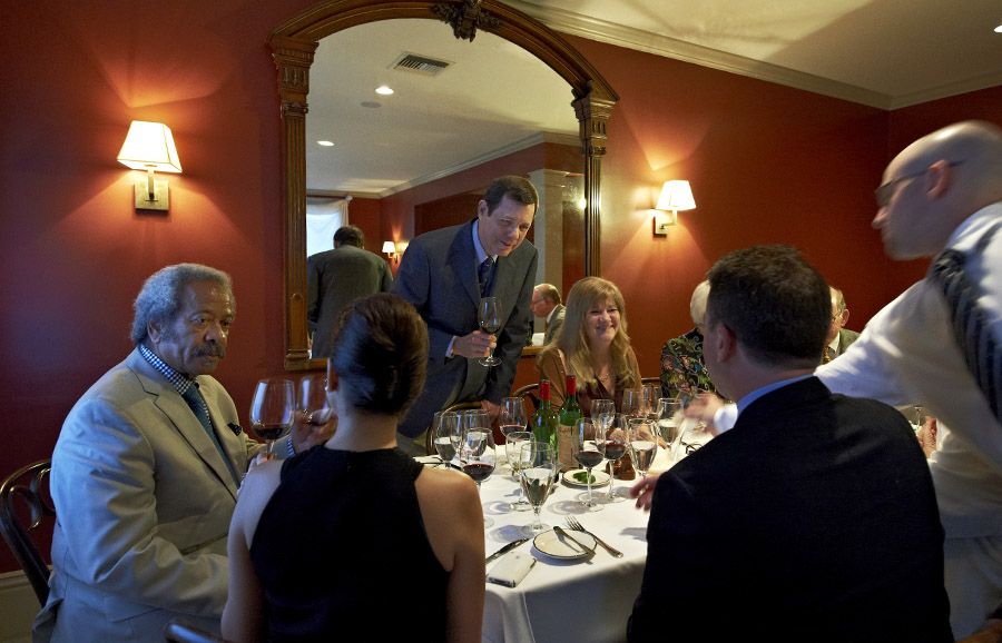 Robert ‘Dr Bob’ DeBellevue MD hosts one of his Grange dinners at Gautreau’s restaurant. Allen Toussaint is on his right and Julie on his left.The 1977, 1979, 1981 and 1983 vintages were served : Photo © Milton Wordley. 