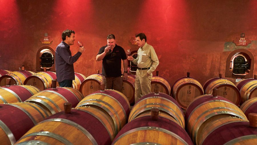 Peter Gago and Jason Barrette barrel sampling with Dr Bob  in Cellar two at Magill : Photo © Milton Wordley.
