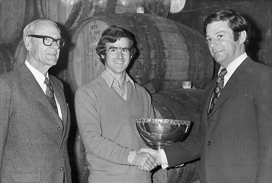 McLaren Vale Wine Show (C1972). Reynella won the Dan Murphy Trophy for  best Cabernet Sauvignon. L to R is Colin Haselgrove (MD of Reynells), Brian and Tim Lang, General Manager of Hungerford Hill.