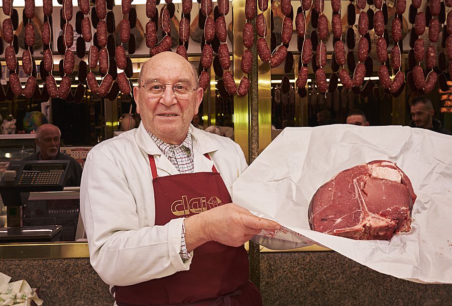 Signor Aretini with a  2.3 kilo T Bone in his Italian butcher shop Macelleria Arezzini in the village of Castel del Piano : Photo © Milton Wordey.