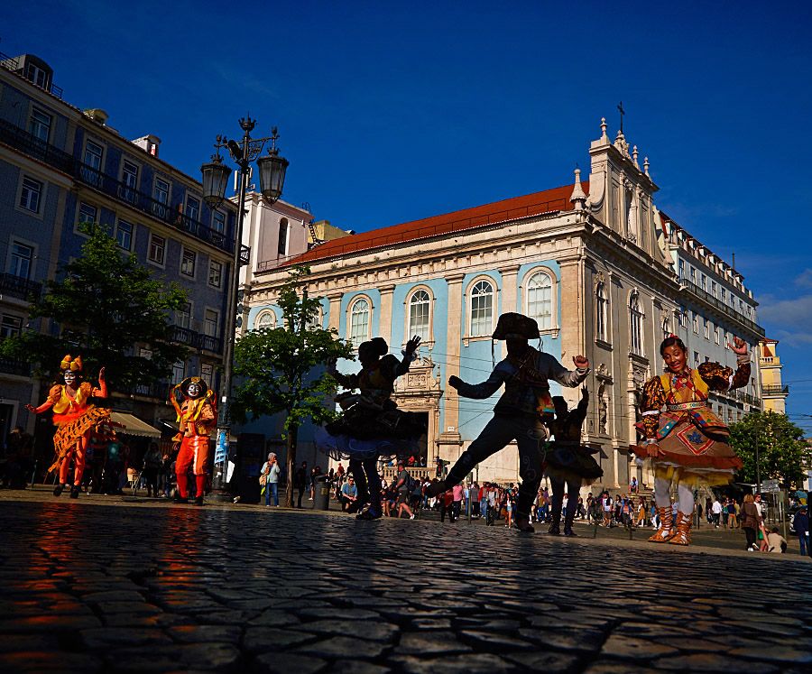 While we were in Lisbon watching a visiting Brazilian dance company in a local square. The light was all wrong, dancers all in the shade. I noticed the building behind them and snap.