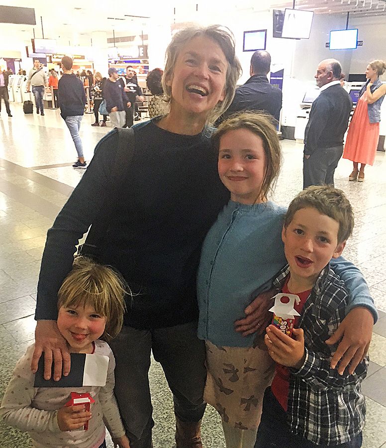 Rachel welcomed home after a recent trip to France by the kids, Martha, Emerson & Quentin.