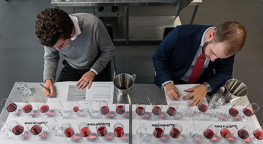 Chief judge Sebastian Crowther on the left, leads the group  at the annual Qantas Rockpool Sommeliers tasting. . Qantas is the third-largest purchaser of wine in Australia, behind only Woolworths and Coles, spending over $15 million annually. 