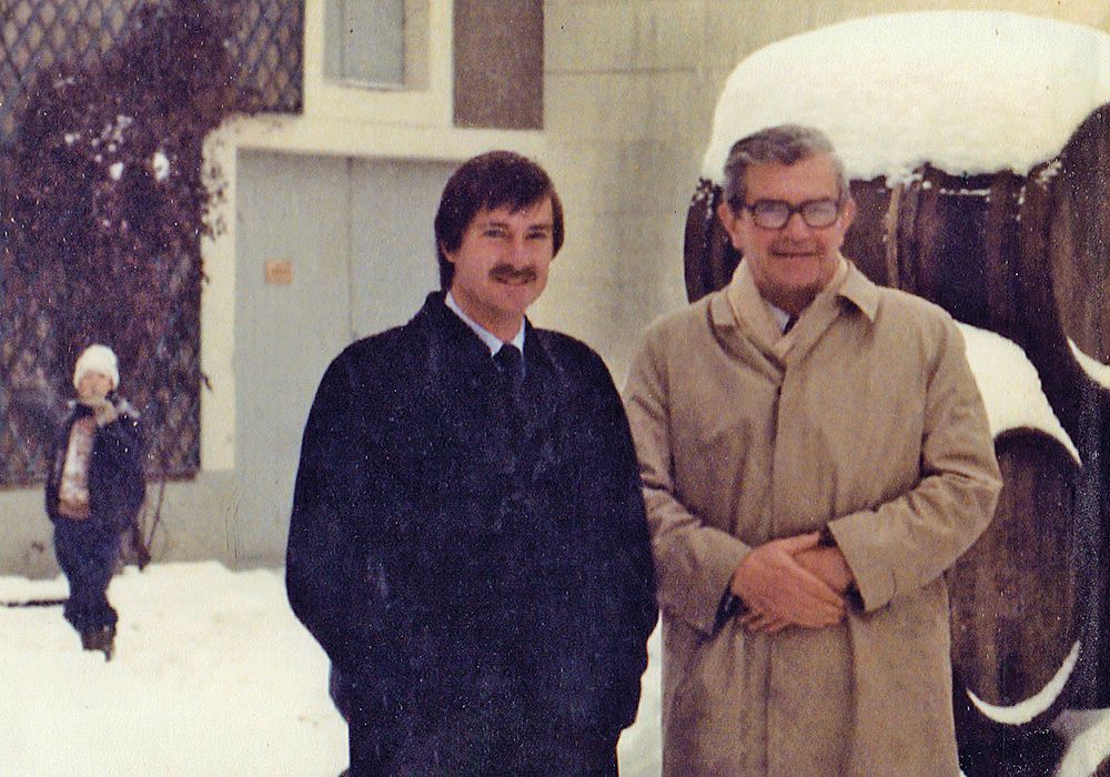Brian Croser and Christian Bizot in the Courtyard of Bollinger on Brian’s first visit to Champagne in December 1983, a young Xavier in the background.