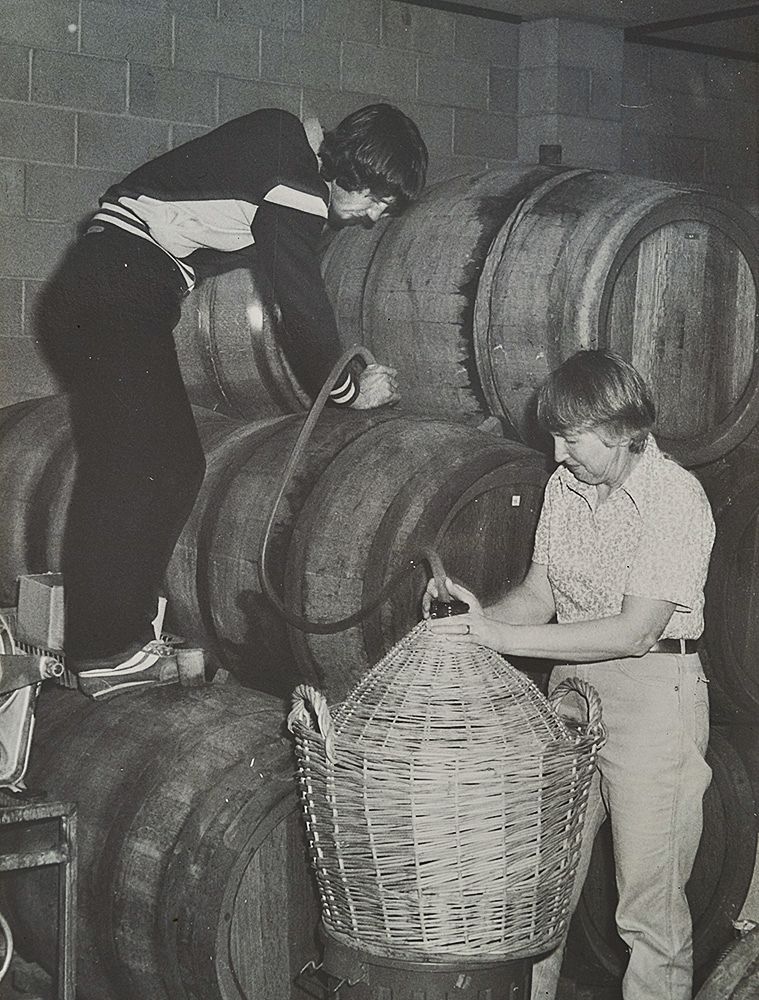 Drew at about 17 yrs old helps his mum Nerida bottling : Photo courtesy Noon Winery.